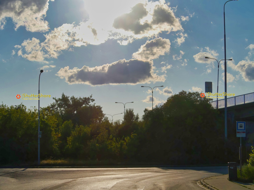 Urban Crossroads Under Sunny Sky