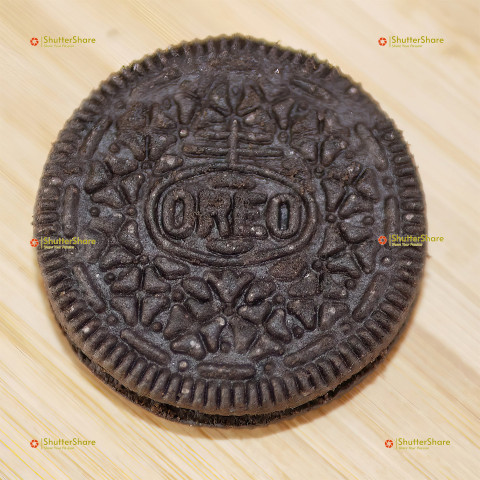 Close-Up of Single Oreo Cookie on Wooden Surface